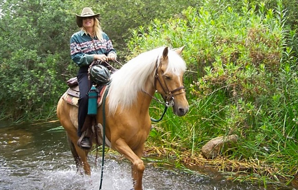 Jody on horse by ocean